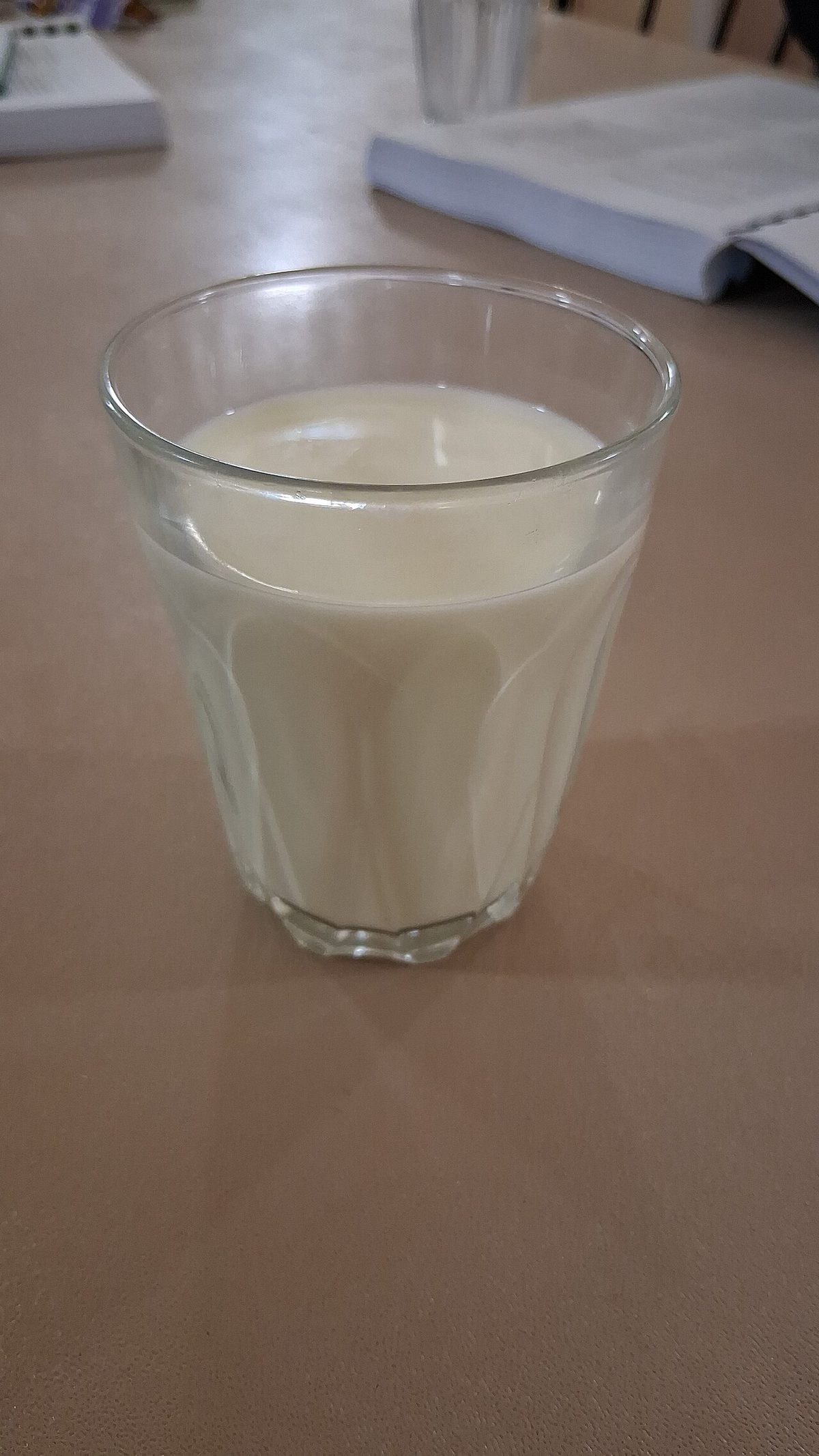 Glass of milk on table