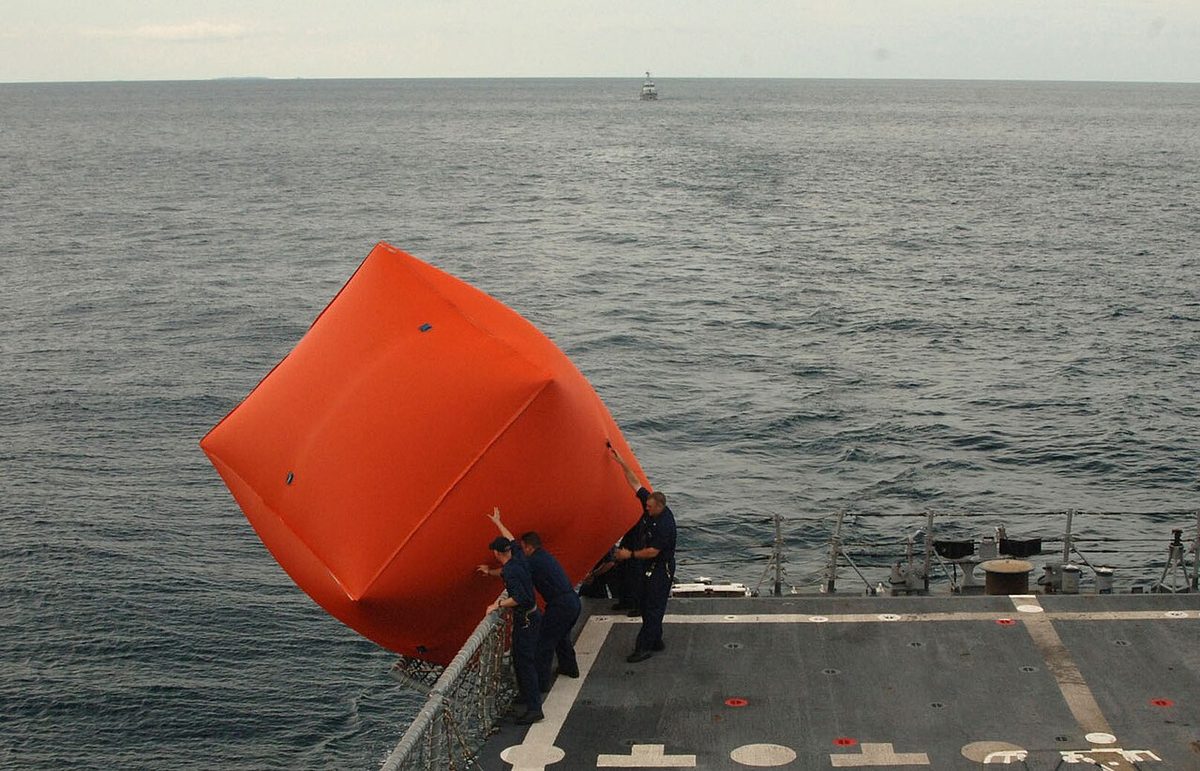 US Navy 101028-N-9156C-073 Sailors aboard the guided-missile frigate USS Commelin (FFG 37) launch an inflatable target